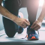 Man tying shoelaces